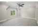 Spacious bedroom with large window and ceiling fan at 109 November Dr, Durham, NC 27712