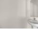 Simple bathroom with pedestal sink and mirror at 863 Old Tarboro Rd, Wendell, NC 27591
