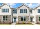 Three-unit townhouse building with stone accents at 863 Old Tarboro Rd, Wendell, NC 27591