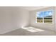 Bright bedroom with carpeted floor and large window offering a view at 863 Old Tarboro Rd, Wendell, NC 27591