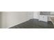 Kitchen area with gray flooring, white cabinets, and granite countertop at 863 Old Tarboro Rd, Wendell, NC 27591