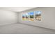 Spacious bedroom with large windows and carpet at 863 Old Tarboro Rd, Wendell, NC 27591