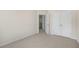 Bedroom with double doors and access to a hallway at 863 Old Tarboro Rd, Wendell, NC 27591