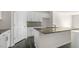 Modern kitchen island with granite countertop and white cabinets at 859 Old Tarboro Rd, Wendell, NC 27591