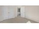 Bedroom with double doors leading to a bathroom and carpet flooring at 859 Old Tarboro Rd, Wendell, NC 27591