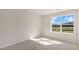 Bright bedroom with a window and carpet flooring at 859 Old Tarboro Rd, Wendell, NC 27591