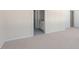 Bright bedroom with carpet flooring and access to bathroom at 859 Old Tarboro Rd, Wendell, NC 27591
