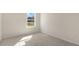 Well-lit bedroom with carpet flooring and a window at 859 Old Tarboro Rd, Wendell, NC 27591