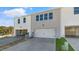 Two car garage with white door and AC unit at 859 Old Tarboro Rd, Wendell, NC 27591