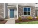 Townhome entrance with teal door and stone accents at 859 Old Tarboro Rd, Wendell, NC 27591