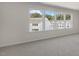Spacious bedroom with large windows offering a view of the neighborhood at 859 Old Tarboro Rd, Wendell, NC 27591
