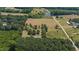 Aerial view highlighting property's location in a rural setting at 113 Amelia Ln, Holly Springs, NC 27540