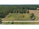 Aerial view showing property's large land area and surrounding landscape at 113 Amelia Ln, Holly Springs, NC 27540