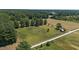 Aerial view of property showcasing wide open spaces and surrounding greenery at 113 Amelia Ln, Holly Springs, NC 27540