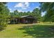 Rustic outbuilding with covered parking and porch at 113 Amelia Ln, Holly Springs, NC 27540