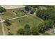 Aerial view showcasing property's ample land and nearby road at 113 Amelia Ln, Holly Springs, NC 27540