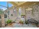 Screened porch with brick wall and charming decor at 2674 Stanton Hill Rd, Cameron, NC 28326