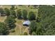 Overhead view of a dark-colored outbuilding nestled within a verdant landscape at 113 Amelia Ln, Holly Springs, NC 27540