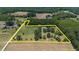 Aerial view showcasing the property's size and surrounding landscape at 113 Amelia Ln, Holly Springs, NC 27540