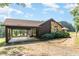 House exterior showcasing stone accents and carport at 8450 Perry Rd, Graham, NC 27253