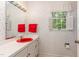 Small bathroom with red sink and floral wallpaper at 8450 Perry Rd, Graham, NC 27253