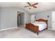 Bright bedroom featuring a wooden bed frame and ceiling fan at 8450 Perry Rd, Graham, NC 27253