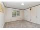 Simple bedroom with neutral walls and carpeting at 8450 Perry Rd, Graham, NC 27253