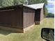 Exterior view of a wooden garage building at 8450 Perry Rd, Graham, NC 27253