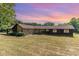 Ranch style home with stone and wood siding at 8450 Perry Rd, Graham, NC 27253