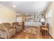Open living area with built-in shelving and hardwood floors at 8450 Perry Rd, Graham, NC 27253