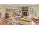 Bright living room showcasing built-in shelving and hardwood floors at 8450 Perry Rd, Graham, NC 27253