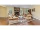 Cozy living room with a stone fireplace and hardwood floors at 8450 Perry Rd, Graham, NC 27253