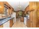 Updated kitchen with wood cabinets and tiled floors at 8450 Perry Rd, Graham, NC 27253