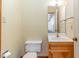 Simple half bathroom with a vanity and toilet at 8450 Perry Rd, Graham, NC 27253