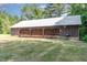 Three-door garage with metal roof at 8450 Perry Rd, Graham, NC 27253