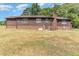 Brick ranch house with wood siding and a large backyard at 8450 Perry Rd, Graham, NC 27253