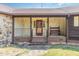 Inviting ranch home with stone accents and a covered porch at 8450 Perry Rd, Graham, NC 27253
