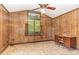 Home office with wood paneled walls and built-in desk at 8450 Perry Rd, Graham, NC 27253