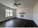 Living room with hardwood floors and a wood mantel at 223 Waterwheel Dr, Selma, NC 27576