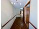 Bright hallway with wood flooring and neutral walls at 1581 Graham Ave # 3, Henderson, NC 27536