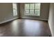 Bright bedroom with hardwood floors and multiple windows at 406 Terry Rd, Hillsborough, NC 27278