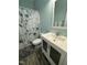Clean bathroom with a shower/tub combo and updated vanity at 970 Southern High School Rd, Graham, NC 27253