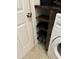 Convenient laundry room with washer, dryer, and built-in shelving at 970 Southern High School Rd, Graham, NC 27253