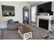Cozy living room featuring a fireplace and ample natural light at 970 Southern High School Rd, Graham, NC 27253