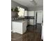 Modern kitchen with white cabinets, granite countertops, and hardwood floors at 970 Southern High School Rd, Graham, NC 27253