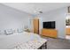 Spacious bedroom with large bed and flat-screen TV at 617 Tower St, Raleigh, NC 27607