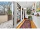 View of backyard patio through glass doors from entry hall at 617 Tower St, Raleigh, NC 27607