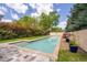 Relaxing lap pool with a spa and stone patio at 617 Tower St, Raleigh, NC 27607