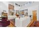 Open living room with high ceilings, hardwood floors, and view of kitchen at 617 Tower St, Raleigh, NC 27607