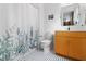 Clean bathroom with updated vanity and tiled floor at 617 Tower St, Raleigh, NC 27607